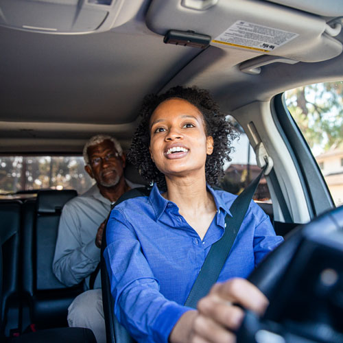 Woman driving car in a ride share