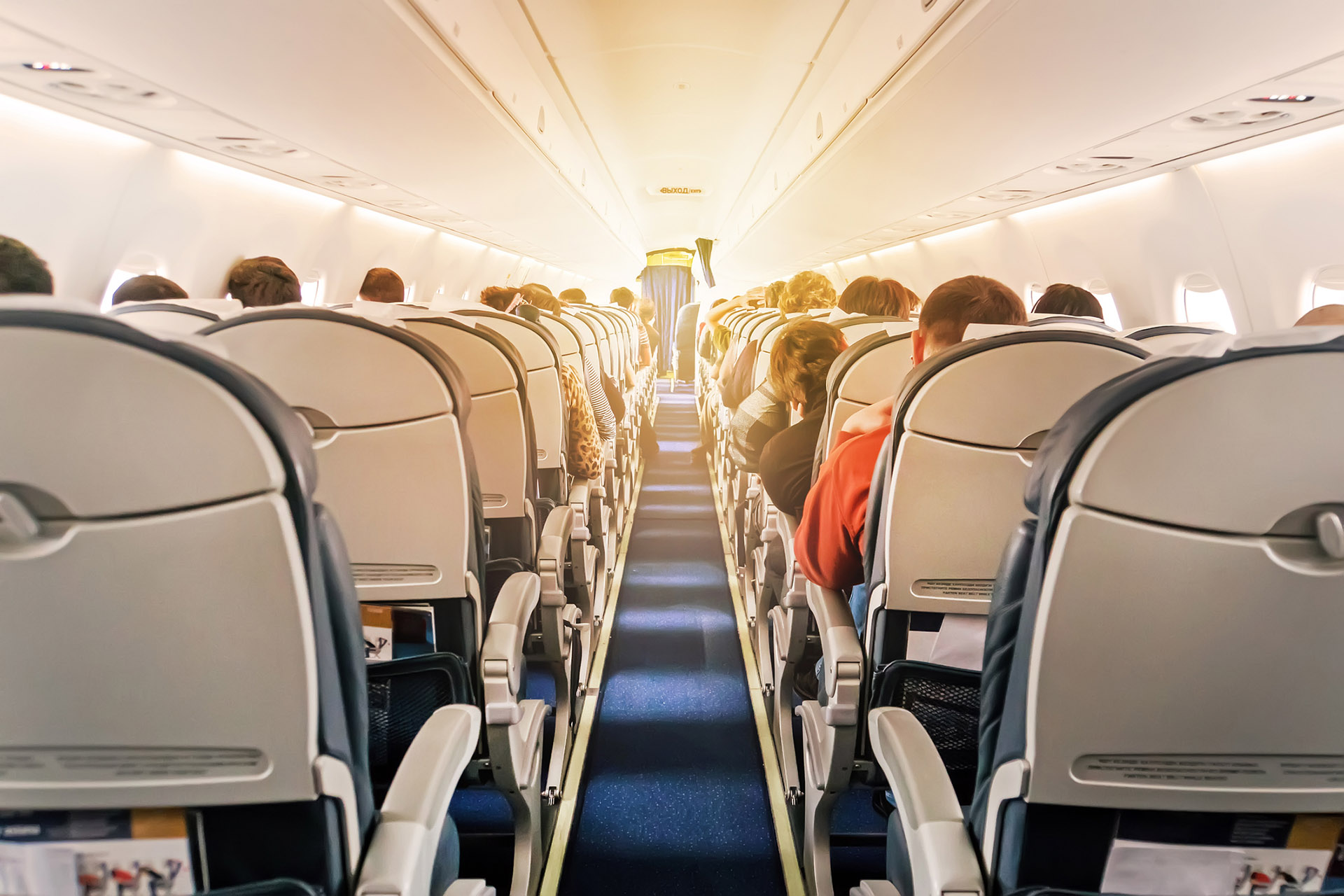Commercial aircraft cabin with rows of seats down the aisle jet lag