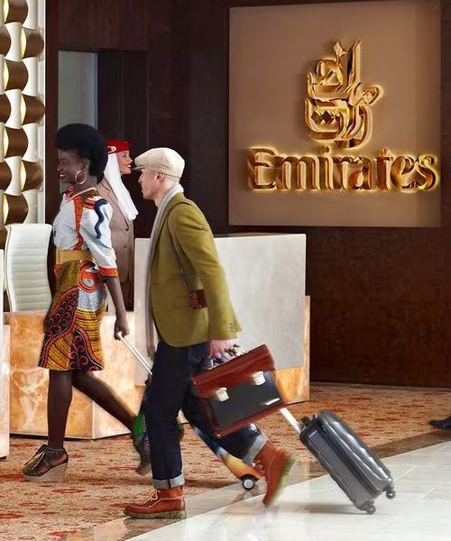 Male and Female in business wear standing at the reception of an Emirates Hotel
