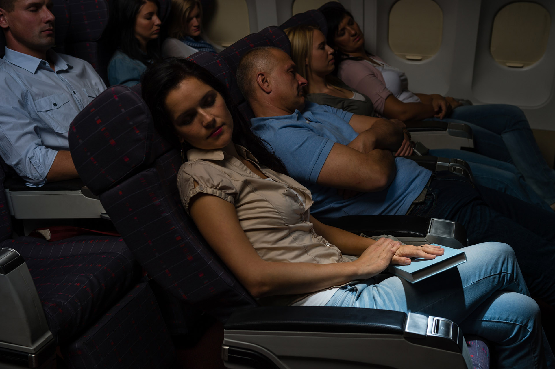 sleeping passengers on a flight